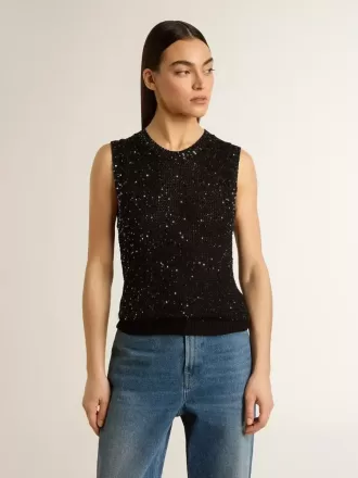 Top de malla negra con lentejuelas y detalles en contraste