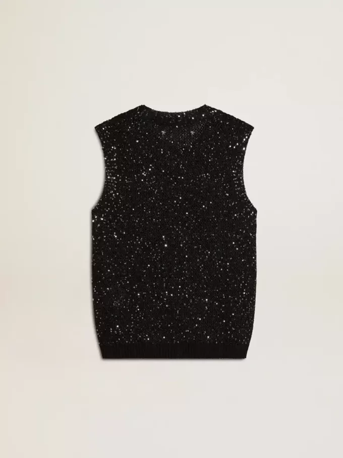 Top de malla negra con lentejuelas y detalles en contraste