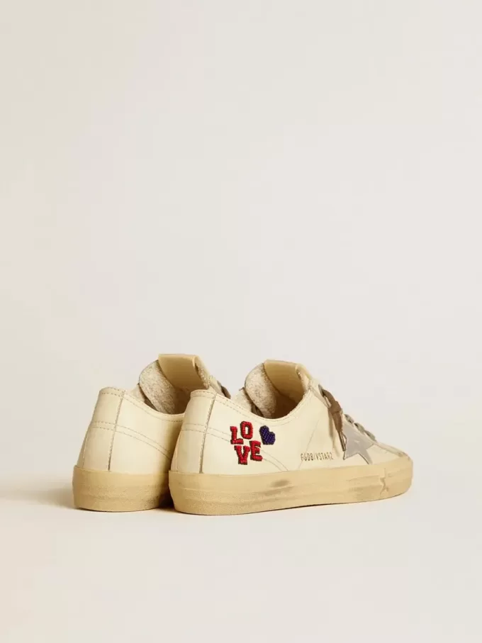 V-Star en napa cruda con estrella de napa plateada y bordado con abalorios