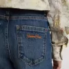 Vaqueros bootcut para niña con lavado medio y bordados