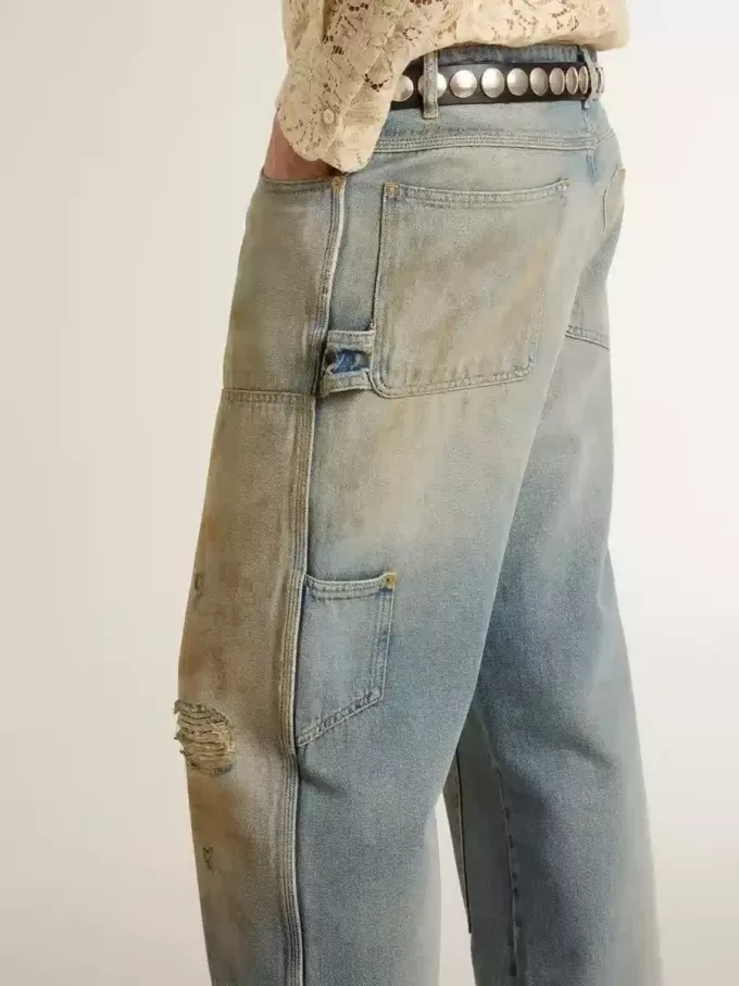 Vaqueros desgastados lavados con arena para hombre