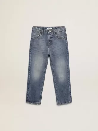 Vaqueros elásticos para niño en denim azul.