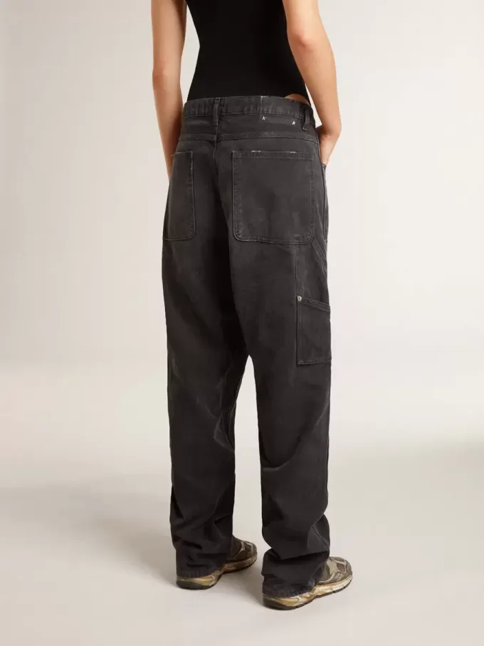 Vaqueros negros de algodón desgastados para mujer con parches en la parte delantera