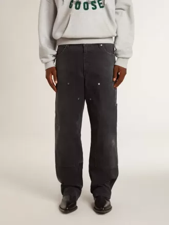 Vaqueros negros desgastados de algodón para hombre con parches frontales