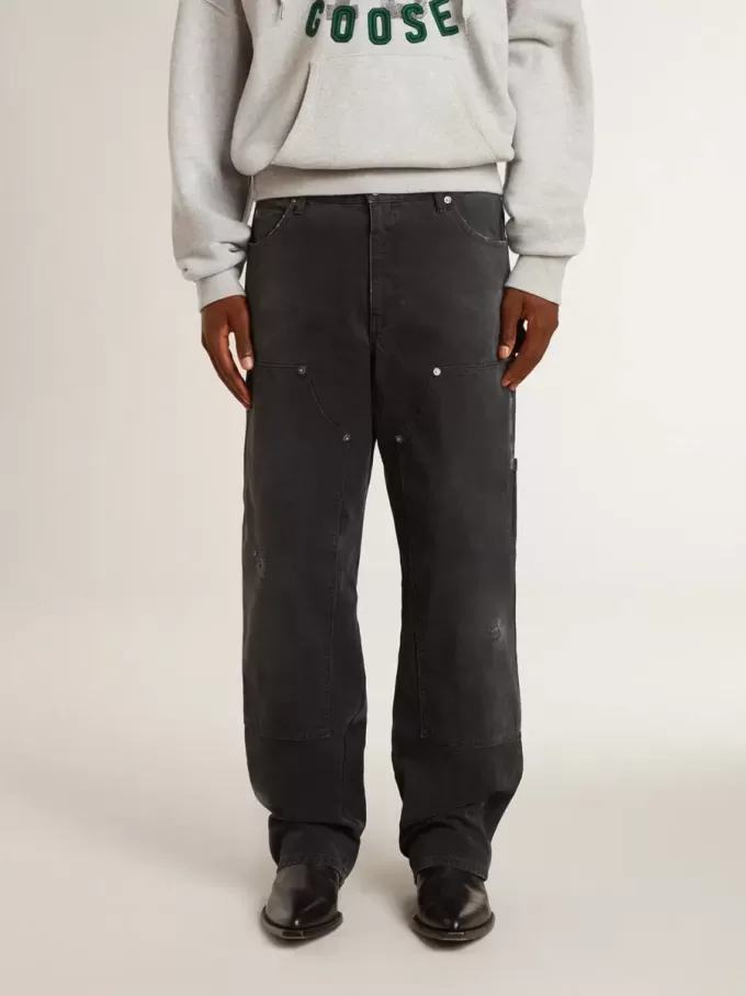 Vaqueros negros desgastados de algodón para hombre con parches frontales