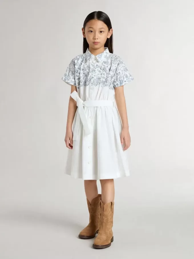 Vestido camisero para niña en lona de algodón blanca con estampado náutico azul y ribetes blancos
