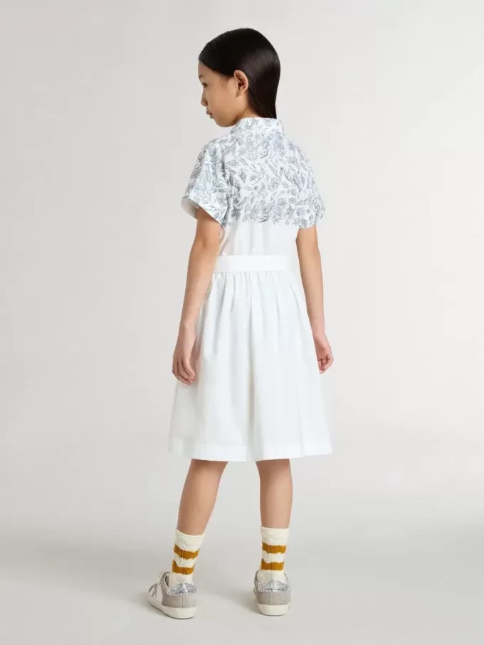 Vestido camisero para niña en lona de algodón blanca con estampado náutico azul y ribetes blancos