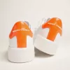 Zapatillas Purestar blancas con lengüeta naranja fluorescente en el talón Zapatillas Purestar blancas con lengüeta naranja fluorescente en el talón
